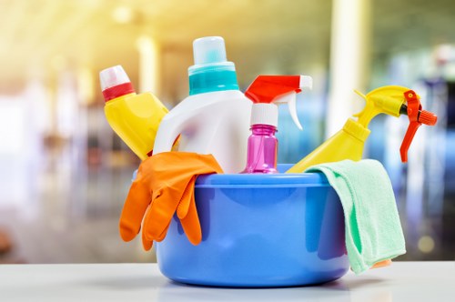 Upholstery cleaning equipment beside a fabric sofa