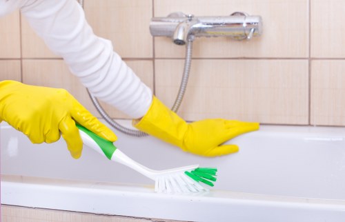 Technician using protective gear during carpet cleaning